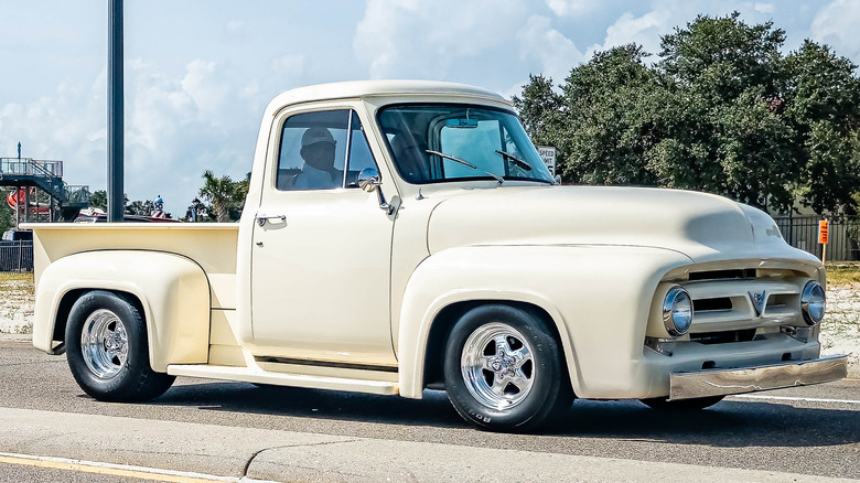 Side shot of a white 1956 Ford F-100