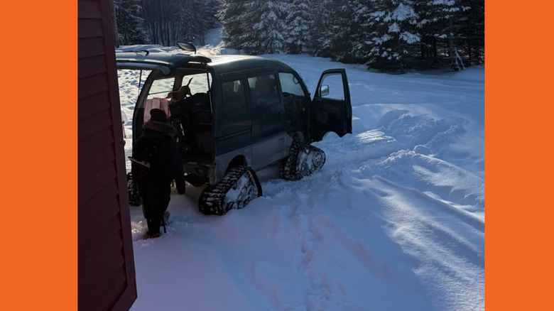 A kei van on tracks in the snow