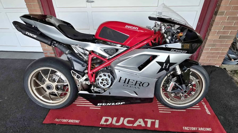 A red and silver Ducati on a Ducati carpet