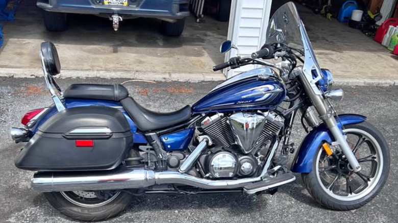 A blue V-Star with windshield and saddlebags
