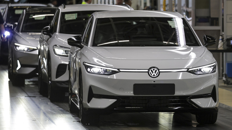 Electric cars on a production line during a walkabout of German Chancellor Olaf Scholz during an election campaign stop at the Volkswagen factory on February 18, 2025 in Emden, Germany.