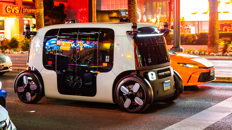 Autonomous Zoox robotaxi driving along Las Vegas Strip at night in Nevada