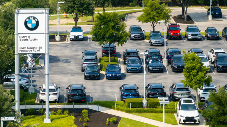 In an aerial view, vehicles are displayed for sale on a lot at the BMW of South Austin dealership on May 16, 2025 in Austin, Texas.