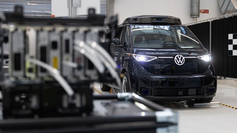 A water-cooled high-performance computer, in which all driving data converges, stands in front of a VW ID. Buzz Autonomous Driving (AD) electric van at the Volkswagen van and bus factory on March 4, 2026 in Hanover, Germany.