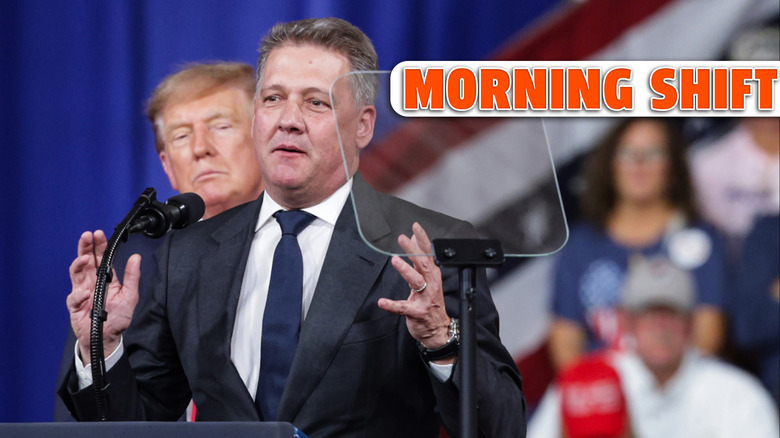 PERRY, GEORGIA - OCTOBER 24: Audi AG CEO Gernot Dollner speaks alongside U.S. President Donald Trump during a midterm campaign rally at the Guardian Centers on October 24, 2026 in Perry, Georgia. Trump is speaking at a rally in support of Georgia Republican Senate candidate, Rep. Mike Collins (R-GA), who is trying to unseat the incumbent U.S. Sen. Jon Ossoff (D-GA), and Georgia Republican gubernatorial candidate Rick Jackson. (Photo by Alex Wong/Getty Images)