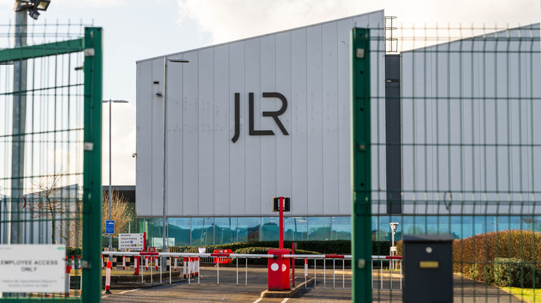 Wolverhampton, UK - February 22 2025: Jaguar Land Rover motor company logo and name outside of a car engine factory
