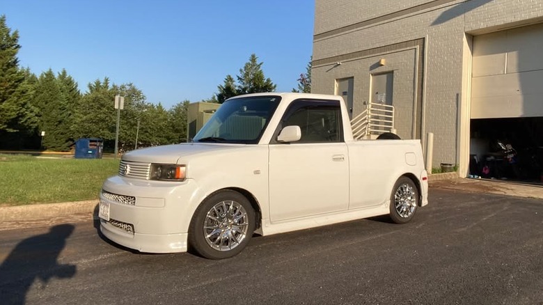 A Scion xB in white with a pickup conversion