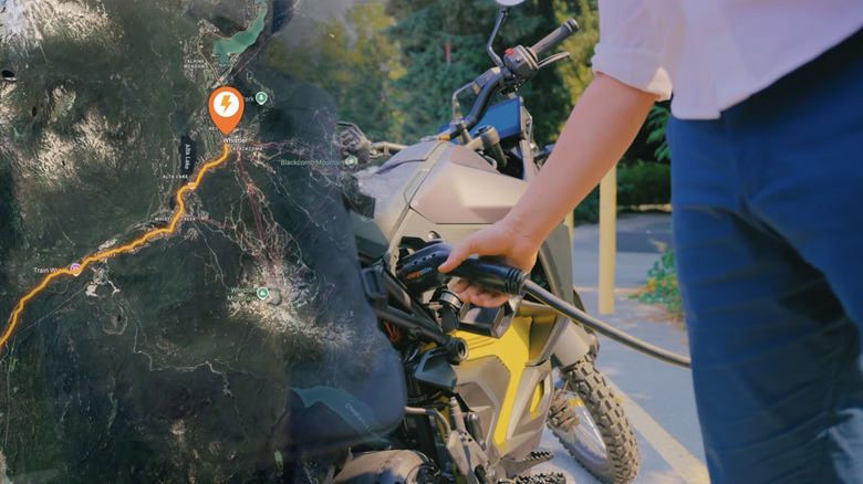 Split screen of a map to Whistler, BC, and a hand plugging an EV charging cable into a motorcycle