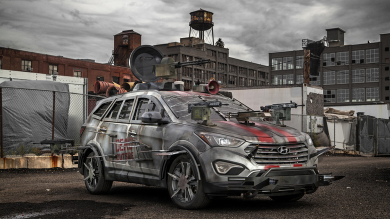 Hyundai Santa Fe Zombie Survival Machine on display near industrial ruins