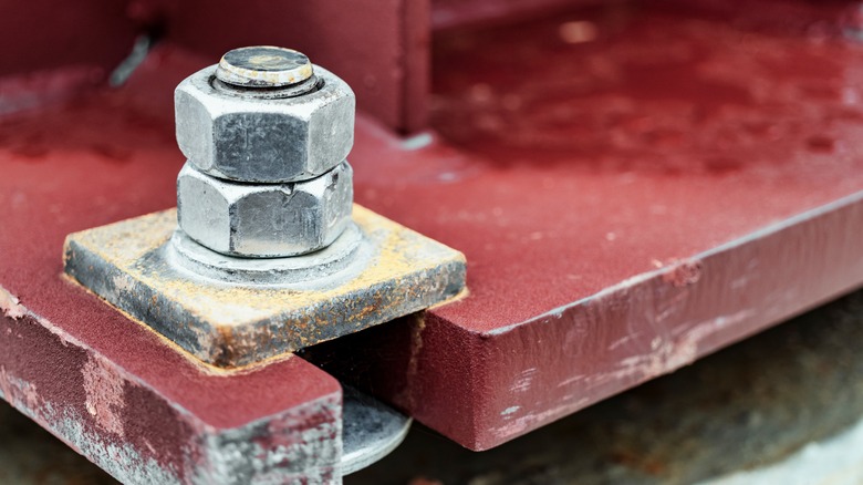 A corner anchor for a metal structure.