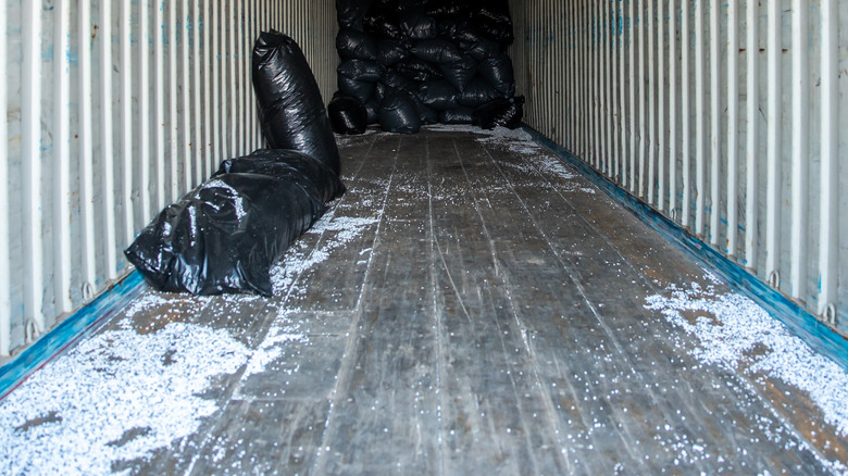 A dirty floor in a cargo container.