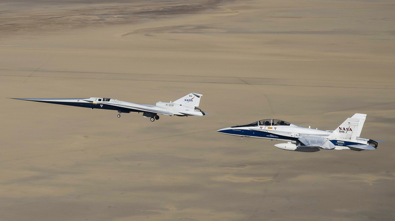 The X-59 with its F/A-18 chase plane on its first flight in October 2025.