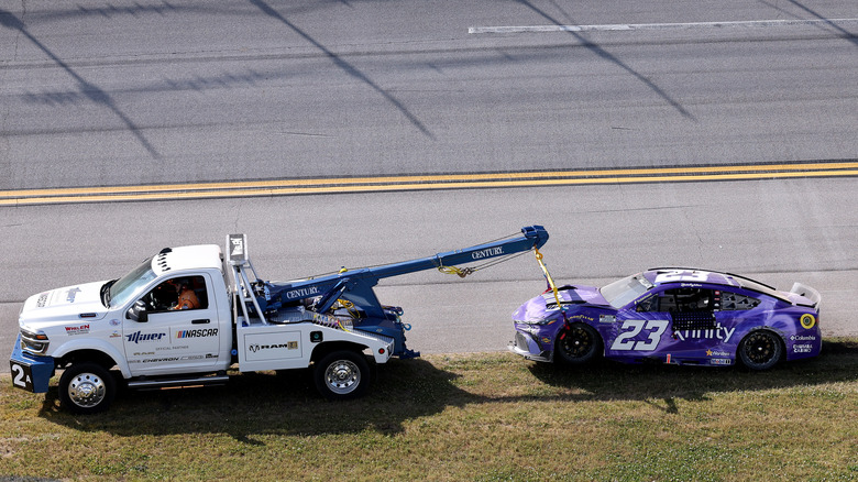 The remains of Bubba Wallace's No. 23 Camry towed off the track after the "Big One" at Talladega.