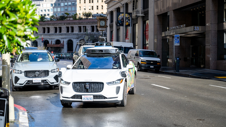 Waymo vehicle approaching the curb to pick up a passenger in downtown San Francisco, California, February 19, 2026. (Photo by Smith Collection/Gado/Getty Images)