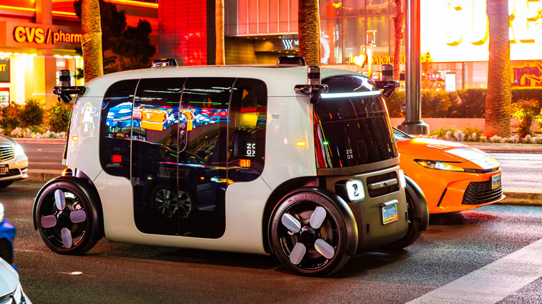 Autonomous Zoox robotaxi driving along Las Vegas Strip at night in Nevada