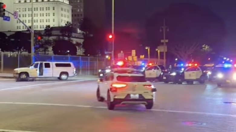 A Waymo robotaxi turning left into the middle of a police felony stop in progress