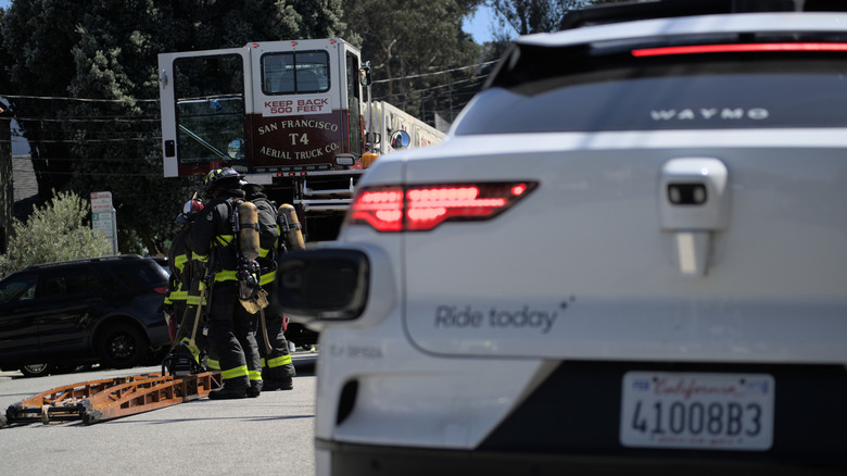 A self-driving Waymo gets in the way of firefighters responding to a fire in California.
