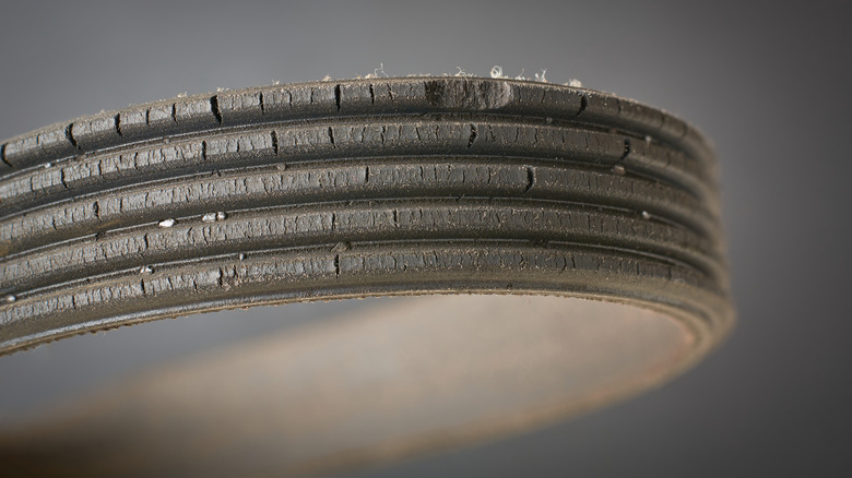 A heavily worn serpentine belt