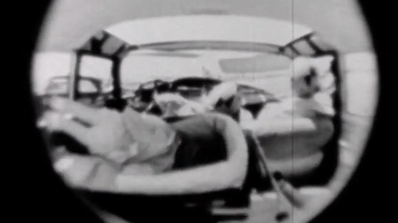 Doll in car bassinet tossed around during a crash test
