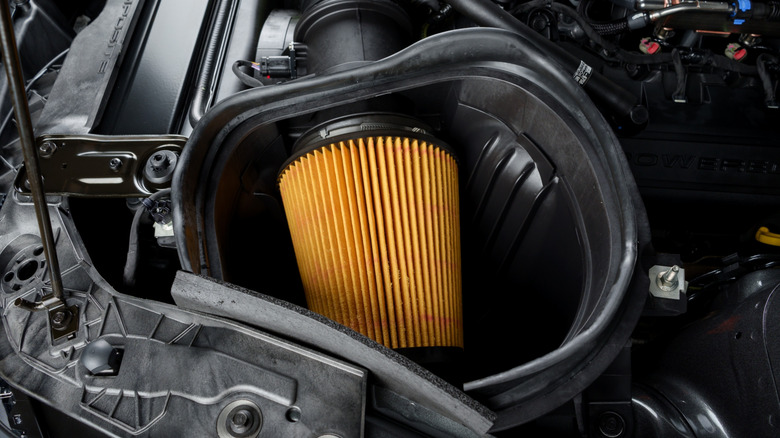 A Ford Shelby GT-350 showcasing a yellow air filter inside its engine bay.