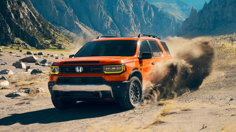 2026 Honda Passport front 3/4 view driving across desert