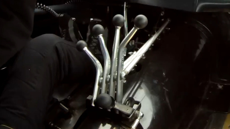 A Lenco transmission shifter setup in a drag-racing car