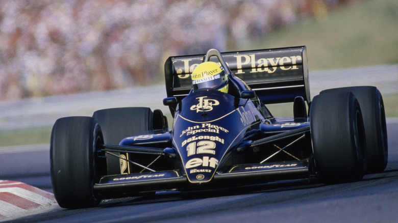 Ayrton Senna behind the wheel of his John Player Special livery on his Renault in Formula 1.