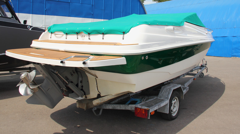 A sterndrive boat on a trailer showing the external equipment susceptible to damage