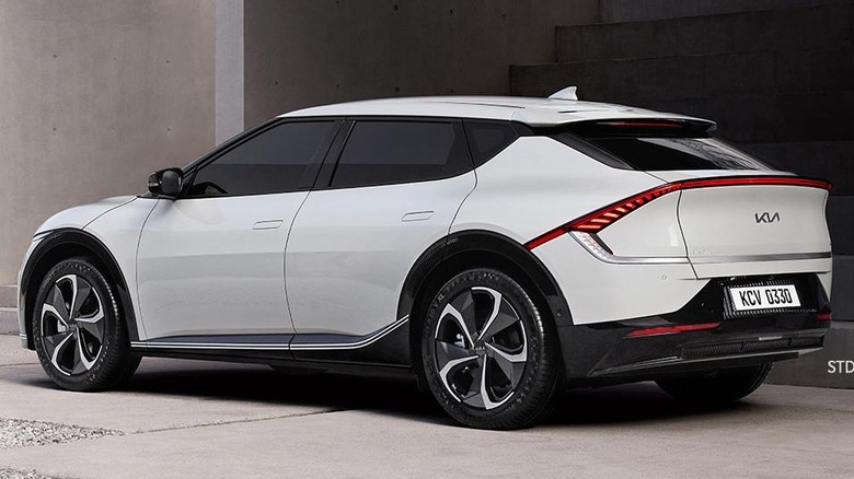Rear-quarter shot of a white Kia EV6
