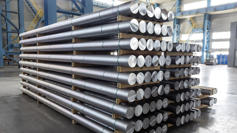 Billets of aluminum stacked in a factory
