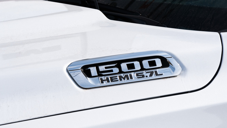 A Ram 1500 5.7-liter badge on a white Ram truck.