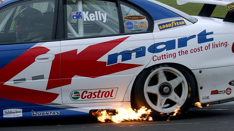 Flames coming out of a V8 racing car's exhaust