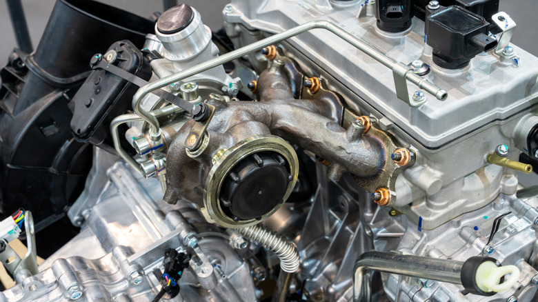 A turbocharger welded to an exhaust manifold.
