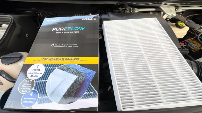 A new HEPA air filter about to be installed in a car