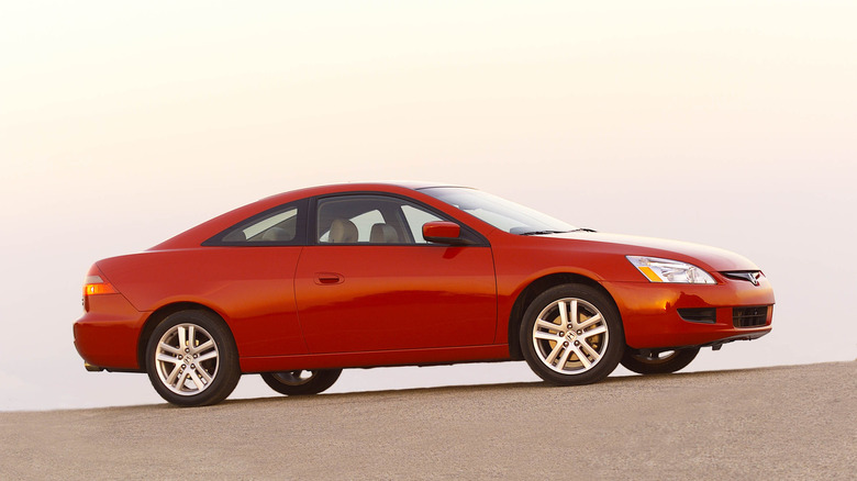 A side shot of a red 2003 Honda Accord
