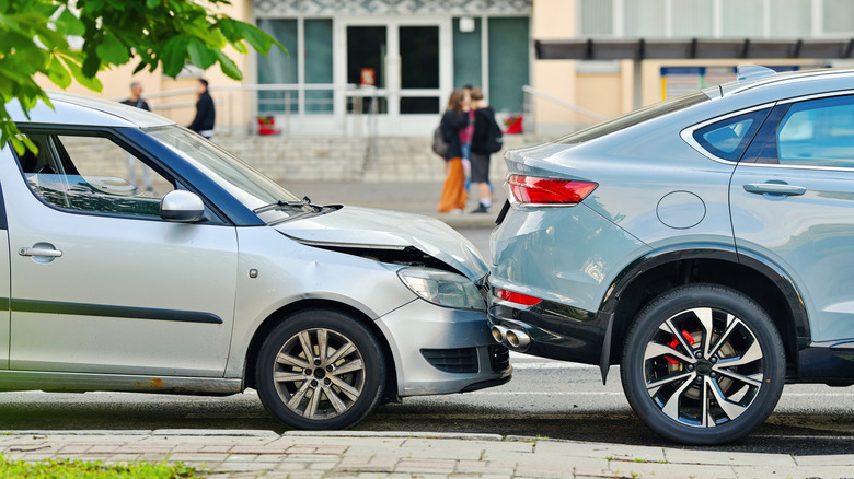 A rear-end collision between two cars on urban street