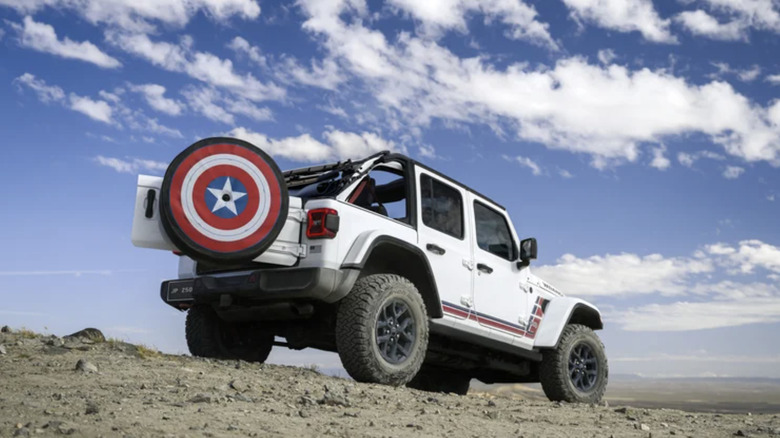 America250-Themed Jeep Wrangler parked on rocky desert ground under a blue sky