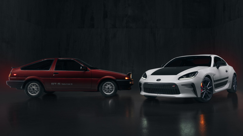 Red Toyota AE86 Corolla next to a white Toyota GR86