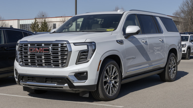 A gray GMC Yukon XL full-size SUV in a parking lot