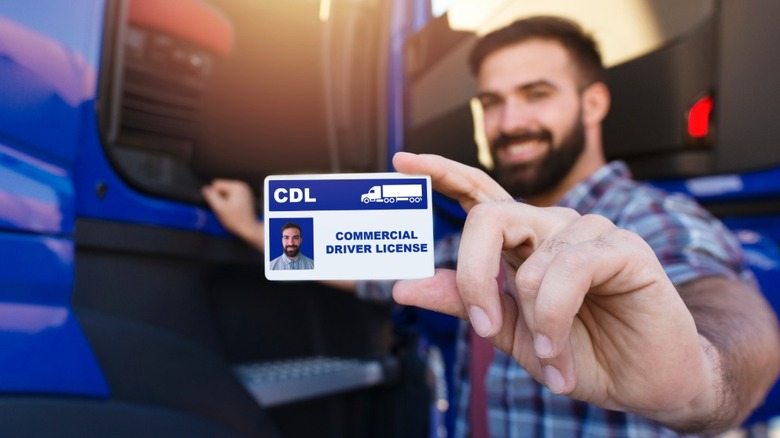 Truck driver holding his CDL