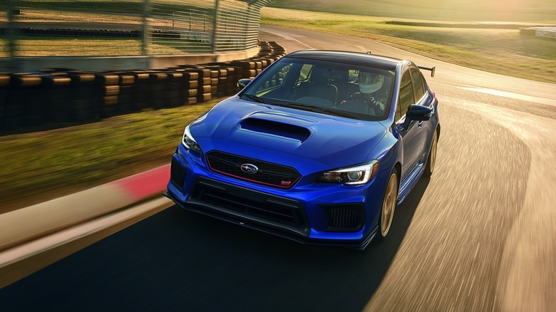 A 2018 WRX STI Type RA in blue on a race track