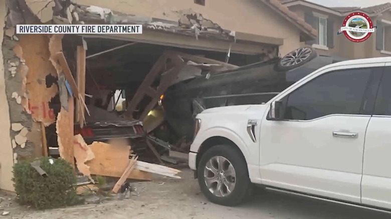 The aftermath of a car flying through the air and smashing into a garage in Southern California