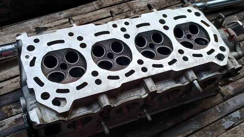 A clean engine head laid down on a table.