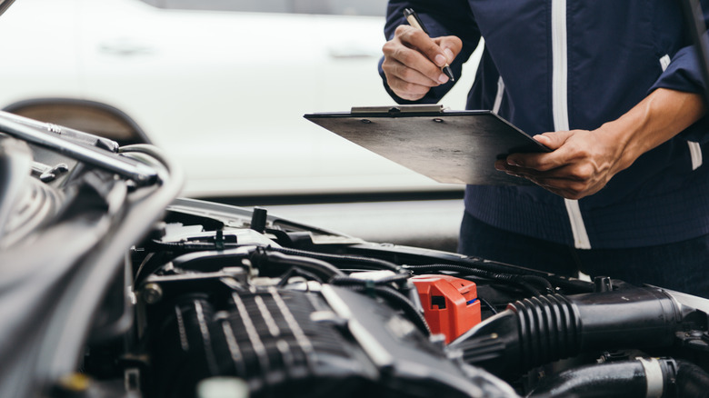 A vehicle being inspected for regulatory compliance.