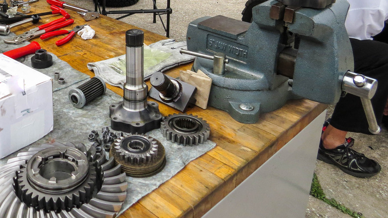 Limited-slip differential components laid out on a work bech during rebuild.