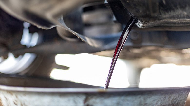Draining old lubricant from the oil pan