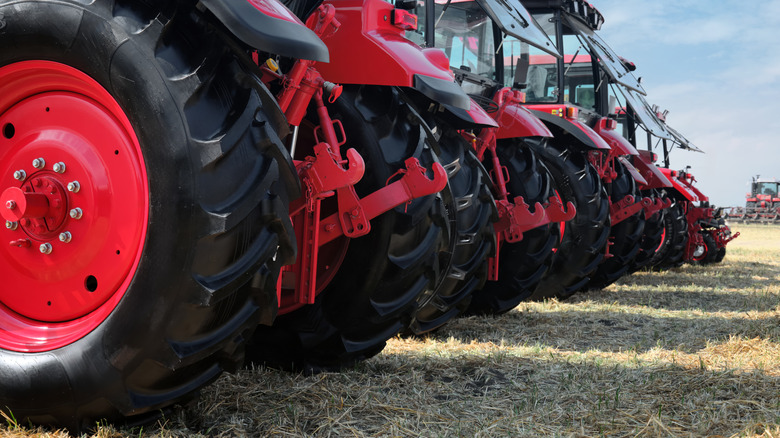 Several tractors lined up next to one another