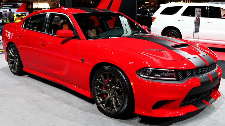 A Dodge SRT Hellcat Charger on display at an autoshow.
