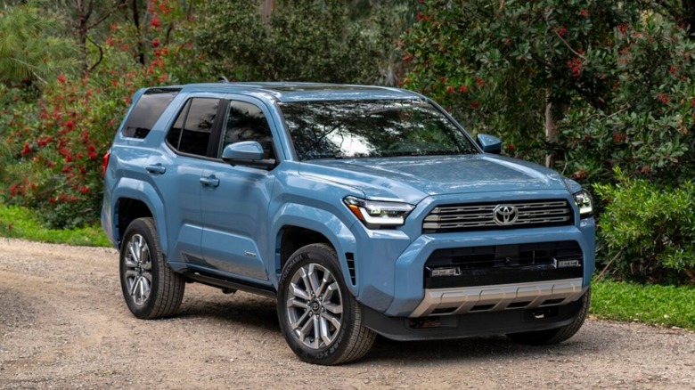 Front shot of a 2025 Toyota 4Runner parked on a gravel road in front of trees