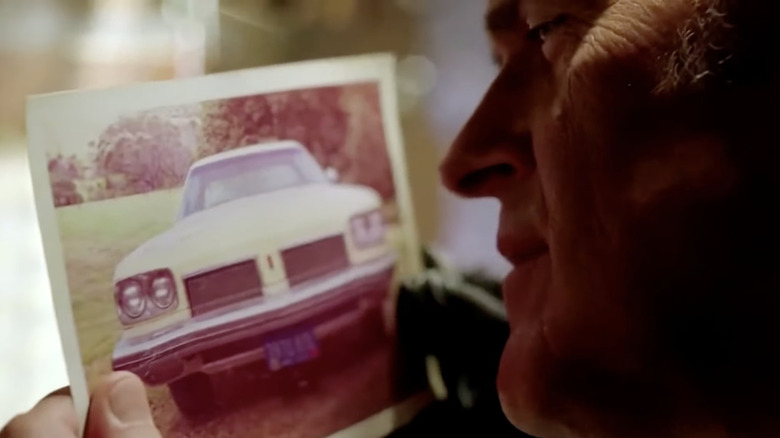 Bruce Campbell lovingly gazes on a picture of the Oldsmobile Delta 88